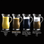 fotografia sobre como elegir la jarra perfecta para espumar la leche para portada de una categoria en una pagina web sobre cafe y cafe expresso y utiliza mucho el color oro b89634 y en menor